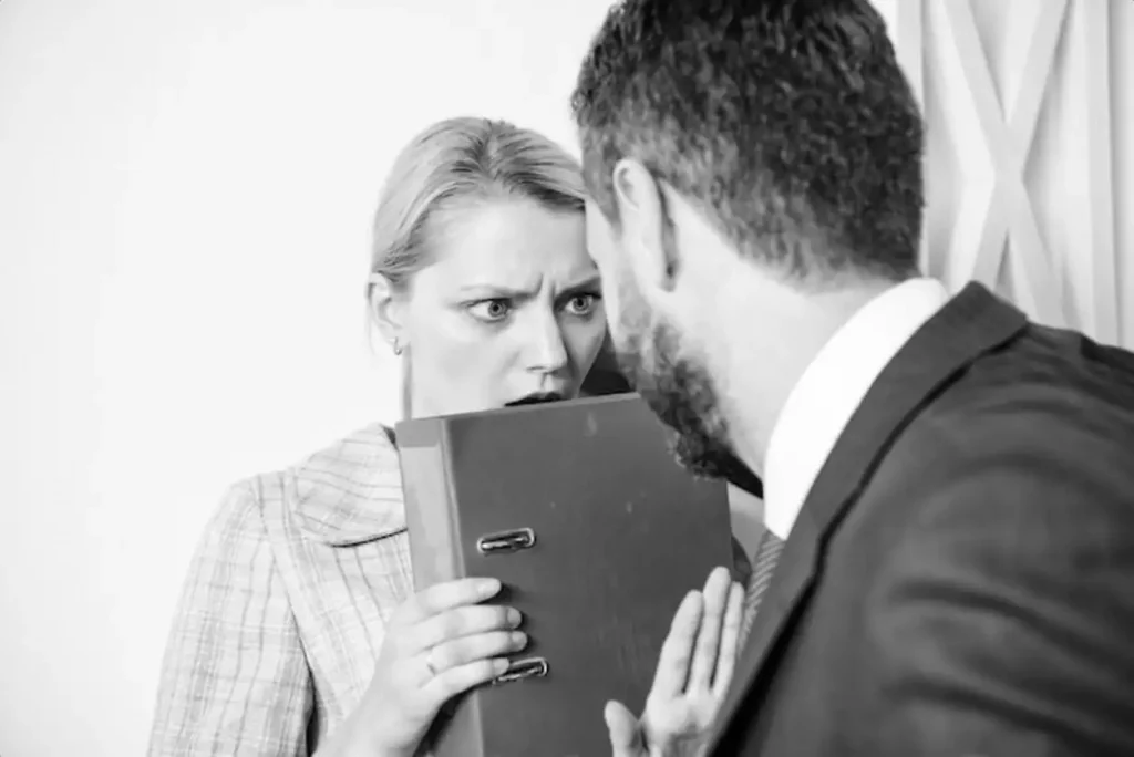 Movement against sexual harassment Manager putting his hand on the shoulder of his secretary