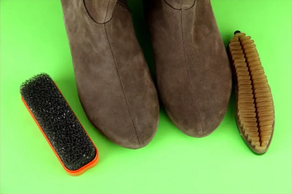 Brushes for suede shoes on color background