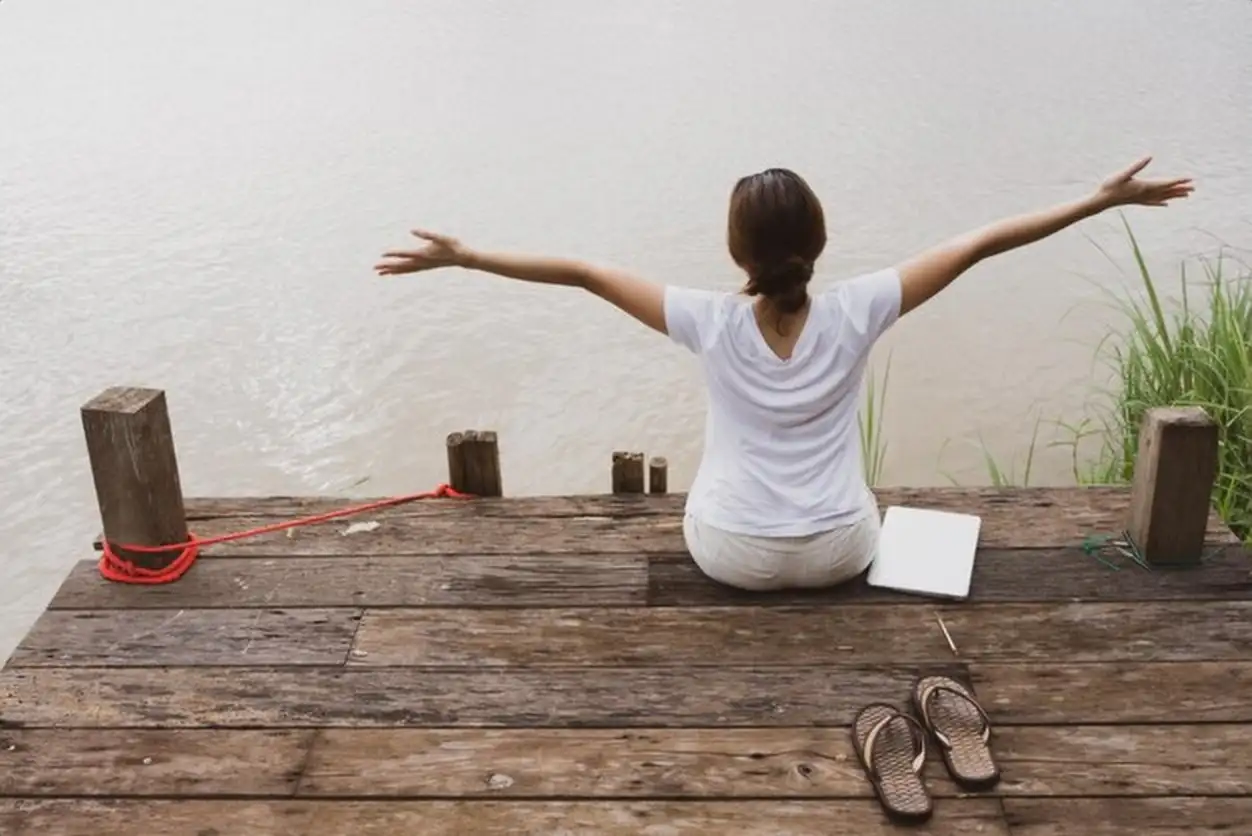 Young adult woman enjoy river view while vacation