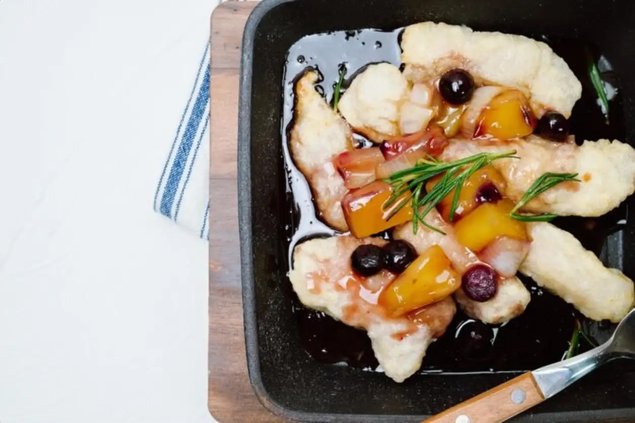 Tangsuyuk chinese food sweet and sour pork A Chinese dish made by frying flourcoated meat and pouring a boiled mixture of vinegar soybean sauce sugar vegetables etc over the meat