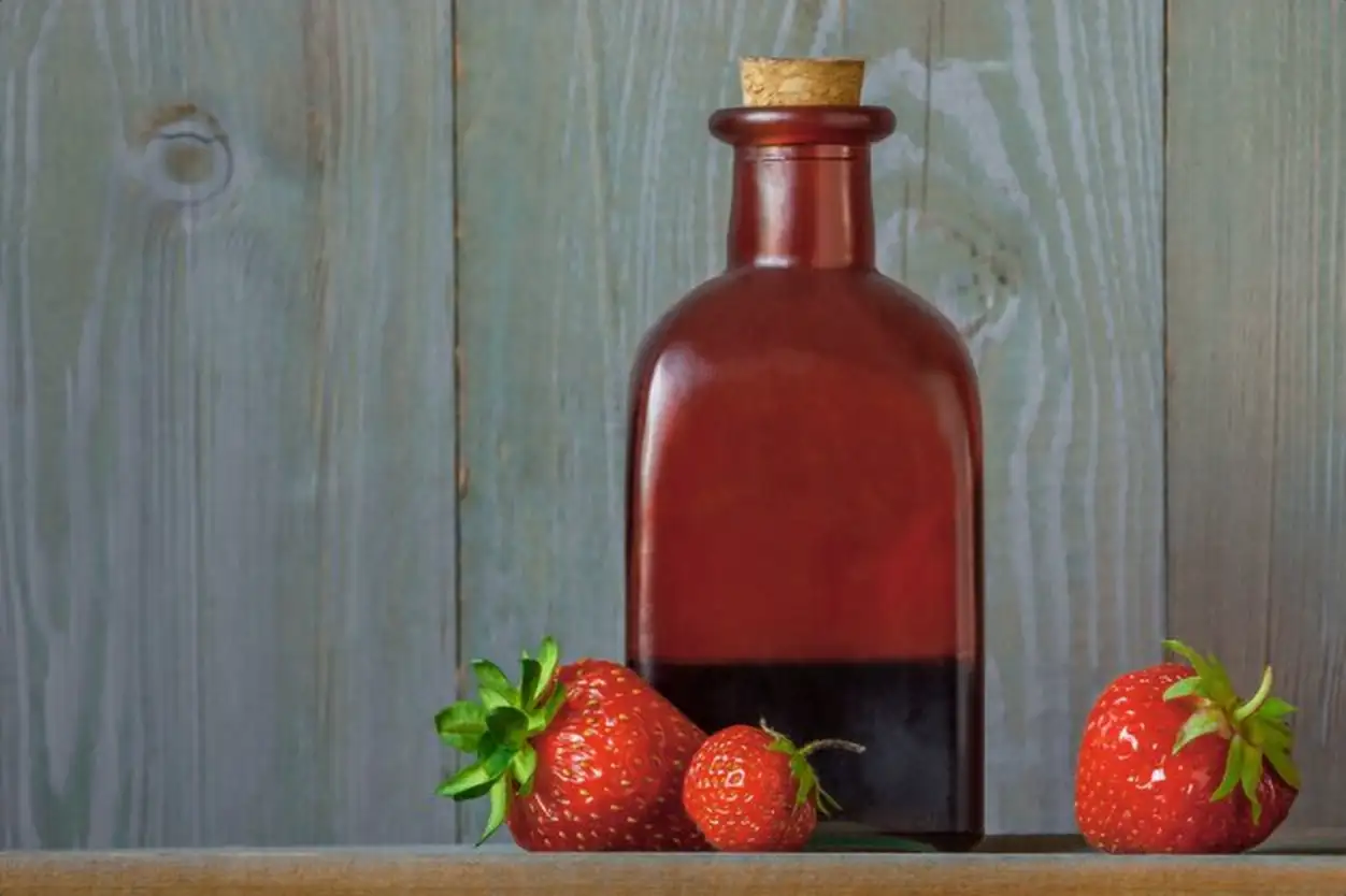 Fresh strawberries and strawberry syrup