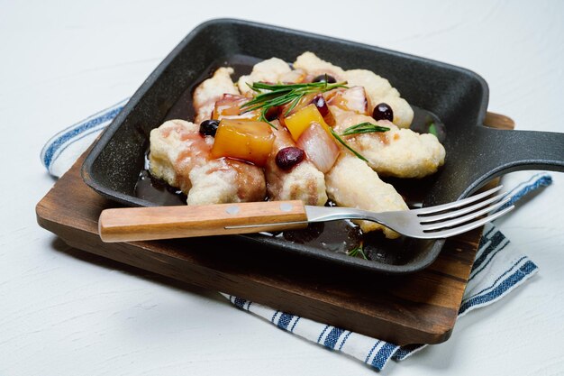 Tangsuyuk chinese food sweet and sour pork A Chinese dish made by frying flourcoated meat and pouring a boiled mixture of vinegar soybean sauce sugar vegetables etc over the meat