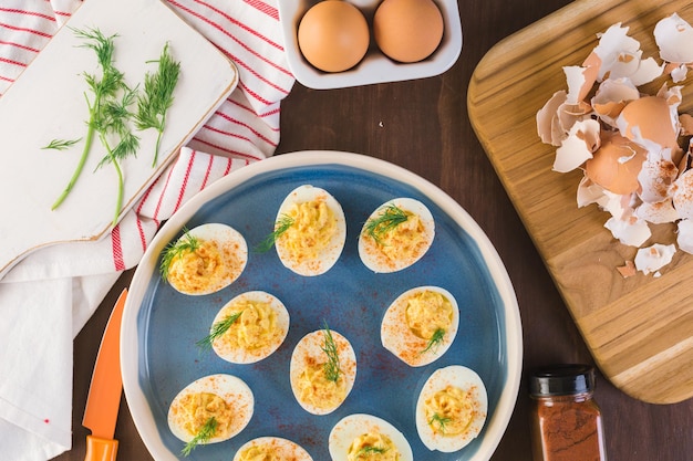 Preparing deviled eggs with organic eggs for appetizer. Step by step recipe.