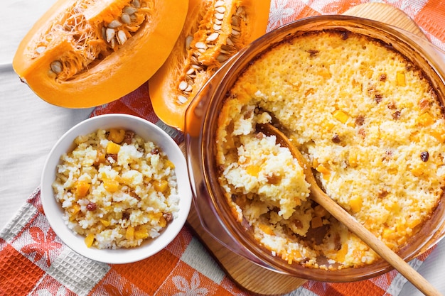 Sweet milky millet and rice porridge with pumpkin and raisins