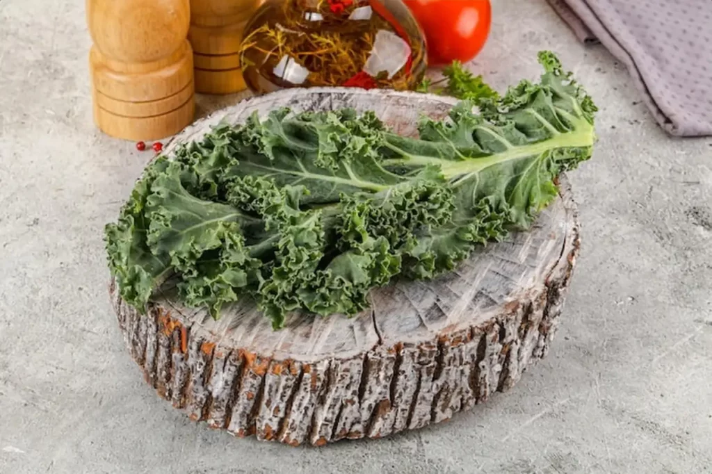 Green Kale cabbage leaves ocer board