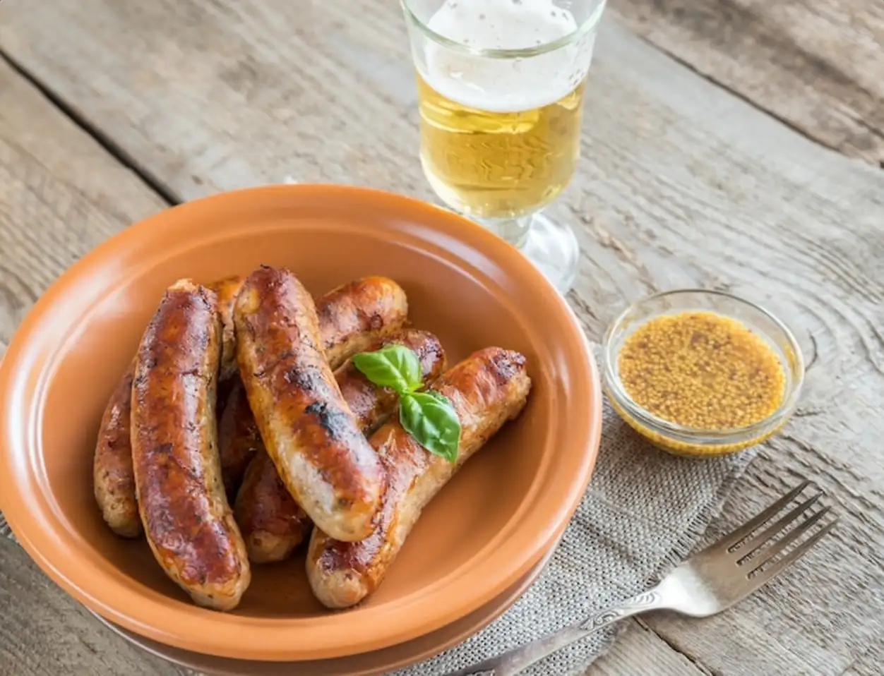 Grilled sausages with glass of beer