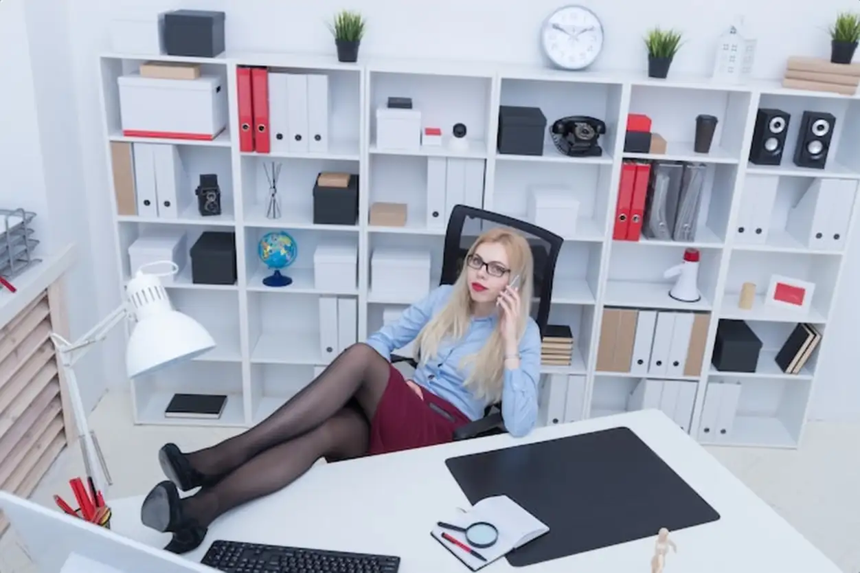Office worker threw his feet on the table