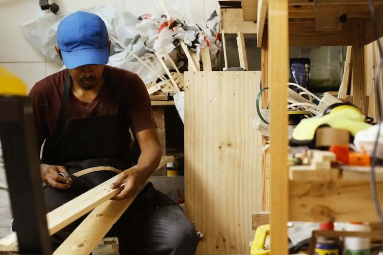 A carpenter working at the workshop