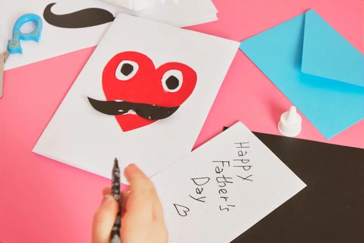Child makes a card for father's day red paper heart with mustache card for dad step by step instructions