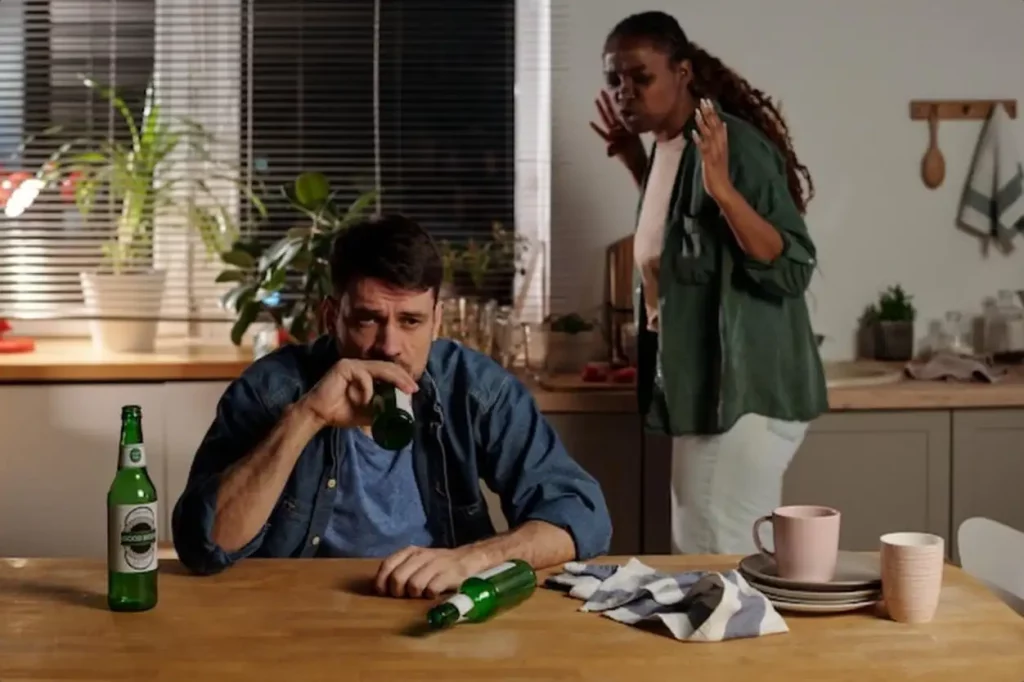 Unhappy young man drinking beer