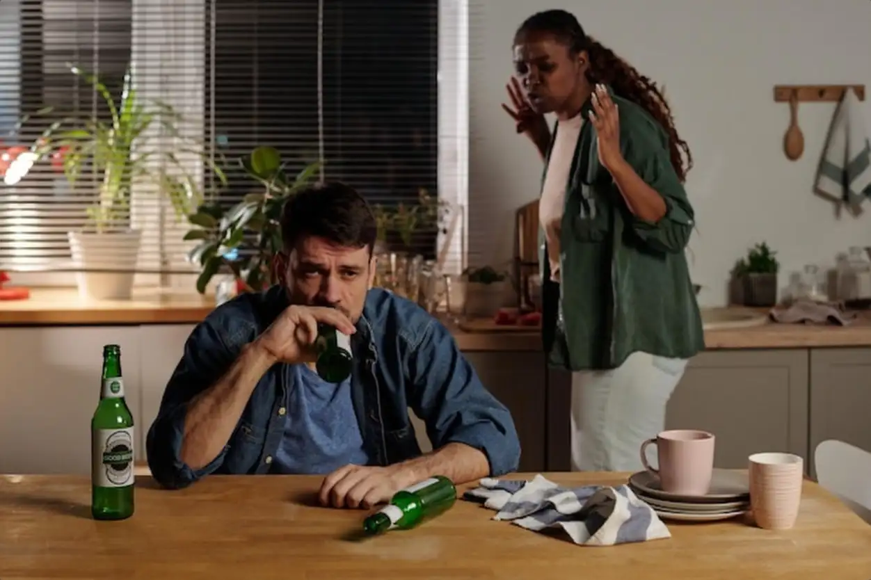 Unhappy young man drinking beer