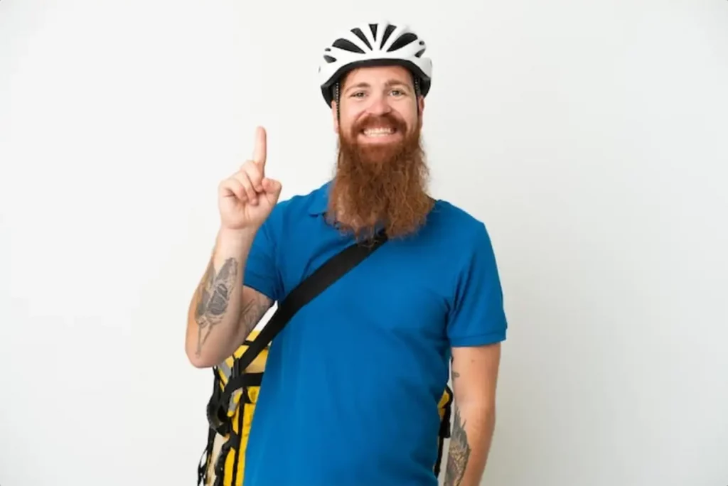 Young reddish caucasian man with thermal backpack isolate don white background showing and lifting a finger in sign of the best