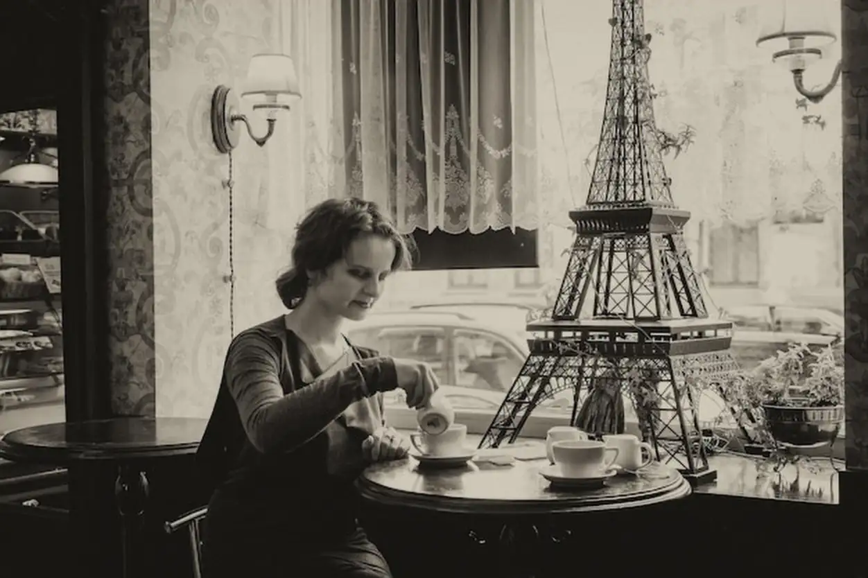 Beautiful girl with a cup of coffee in a cafe with a touch of sepia
