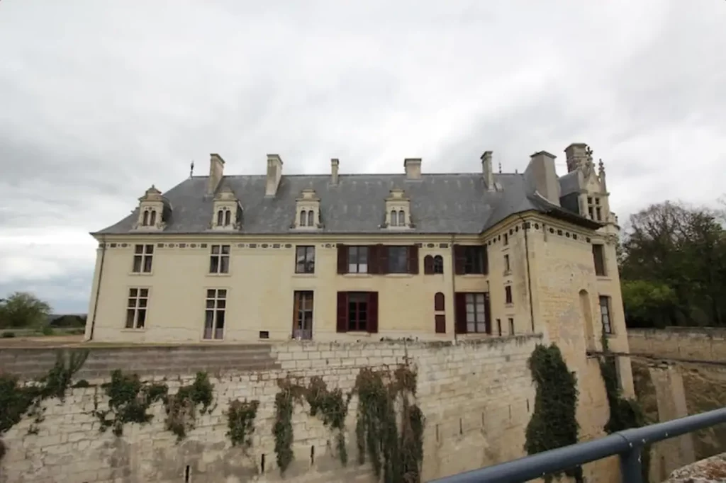Low angle view of building against cloudy sky