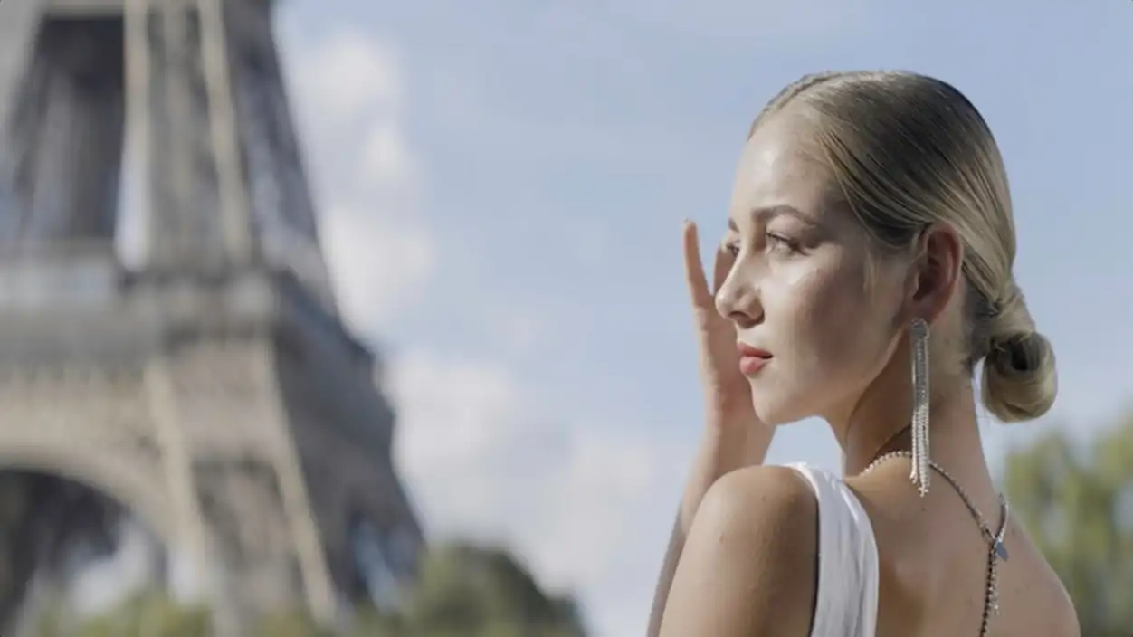 Beautiful model in paris action a lovely woman with a white hairstyle that has long silver earrings