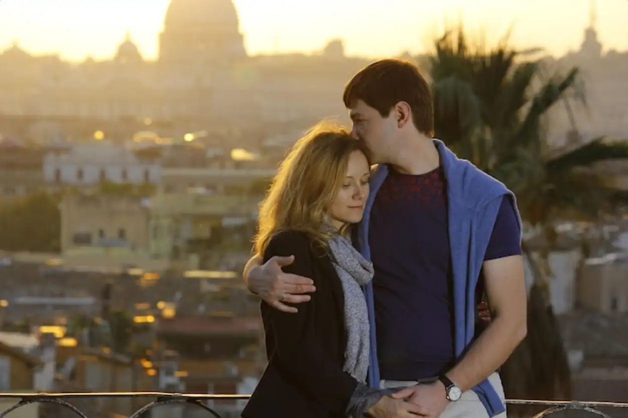 Portrait of loving couple embracing in Rome, Italy. aticano is on background. High quality photo