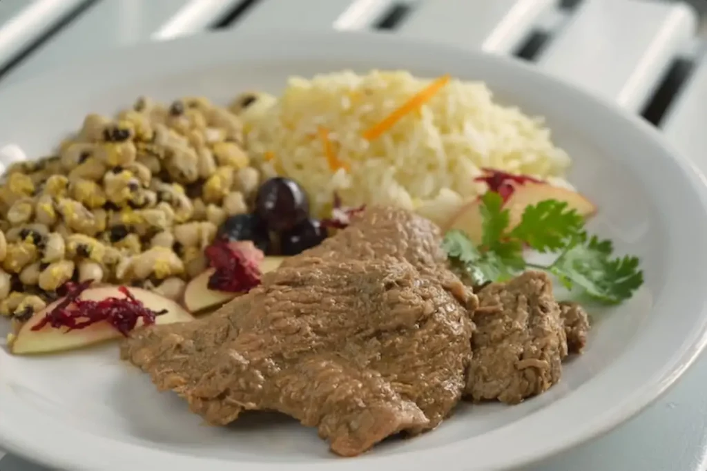 Steak with beans and rice. Healthy and popular dish of Brazilian cuisine.