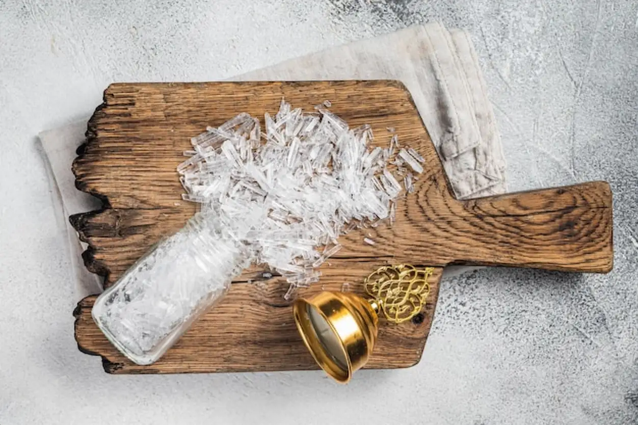 Menthol Crystals Ingredients for production of natural cosmetics White background Top view
