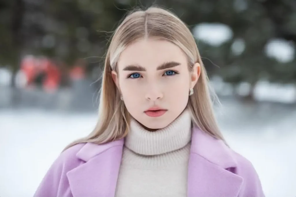 young beautiful brunette woman in winter park