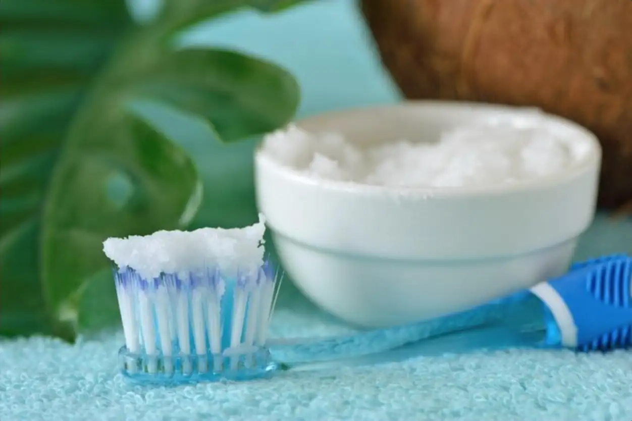 Close-up of baking soda and toothbrush on table