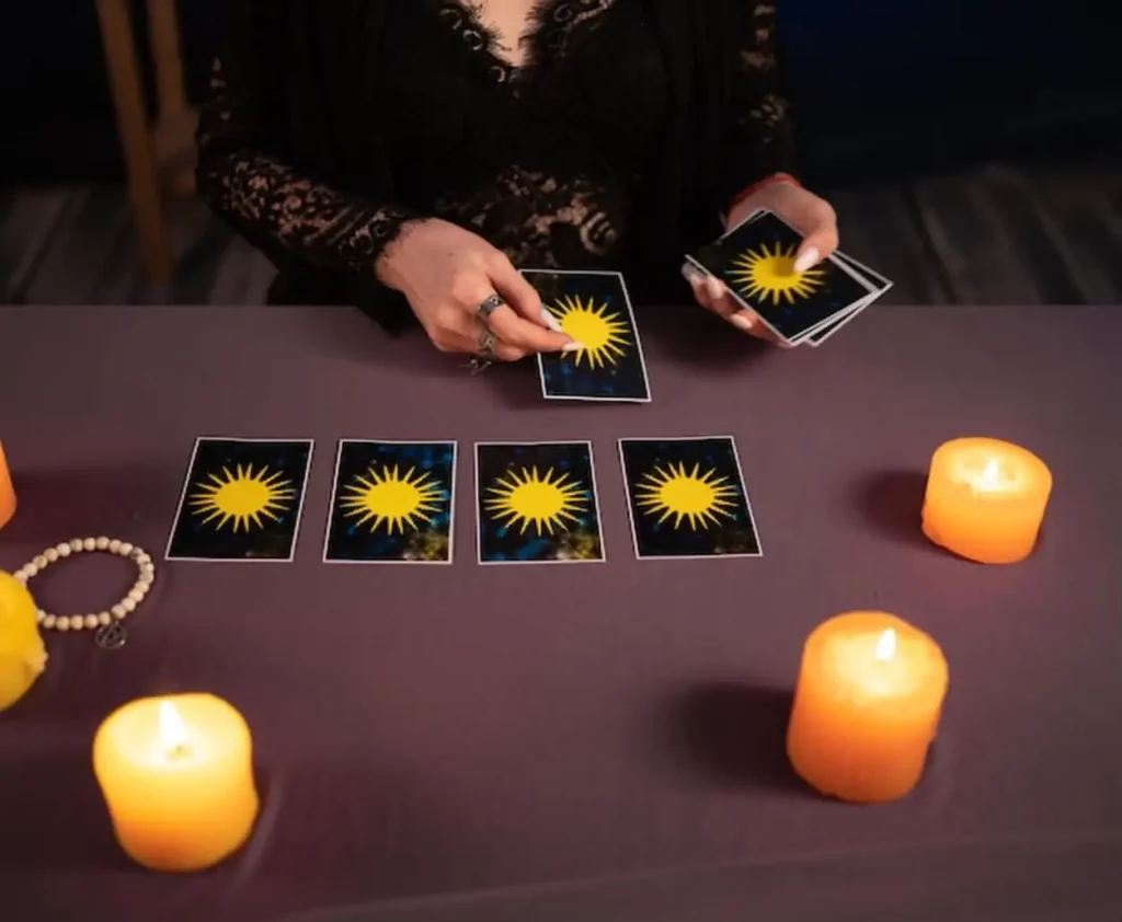 Fortune teller hands and tarot cards on wooden table Divination