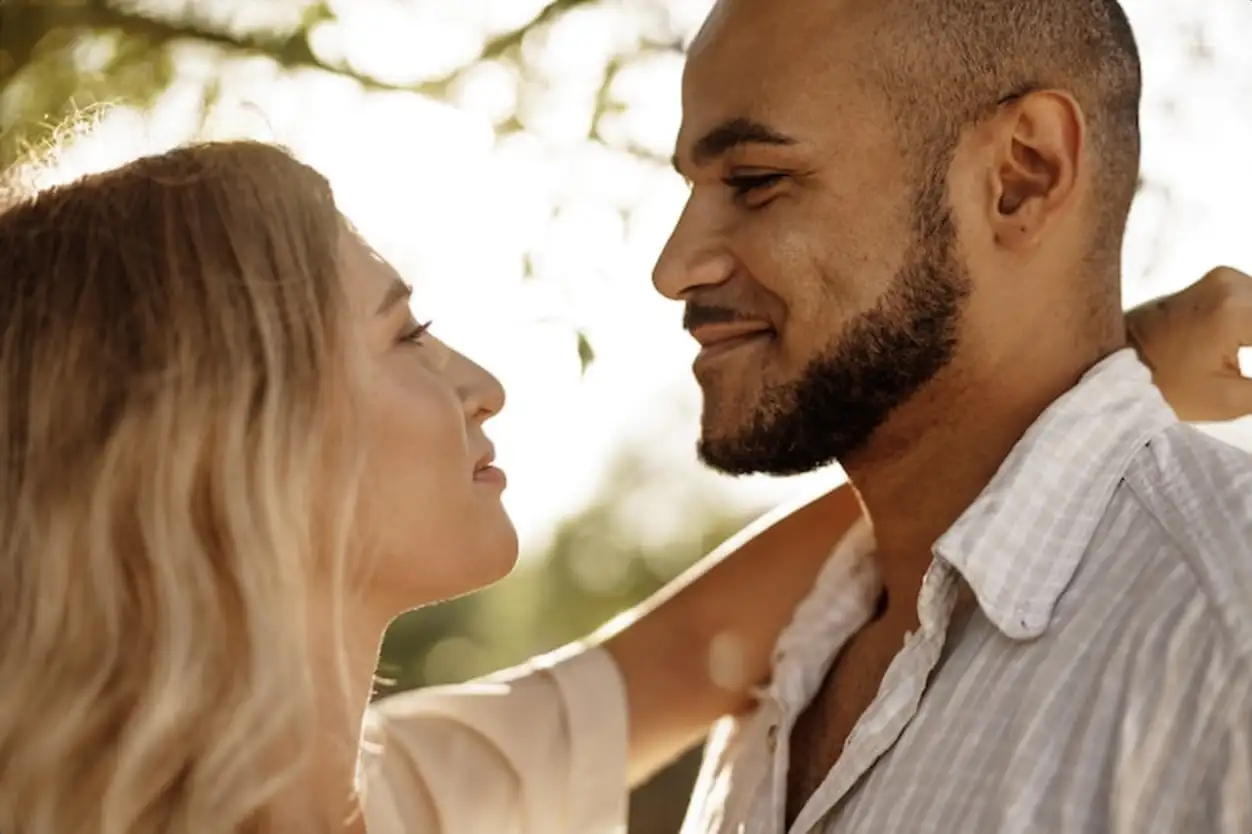Close up of young couple in love enjoying time together outdoors