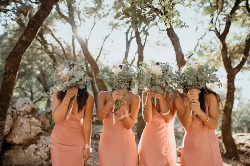 Beautiful bridesmaids in pretty dresses outdoors