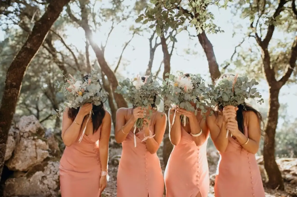 Beautiful bridesmaids in pretty dresses outdoors