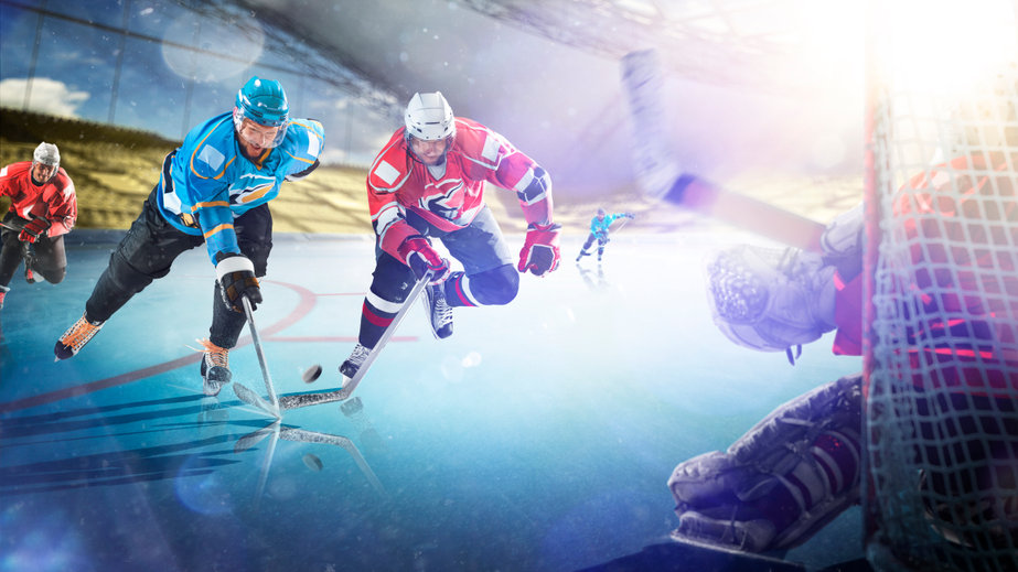 Joueurs de hockey disputant le palet