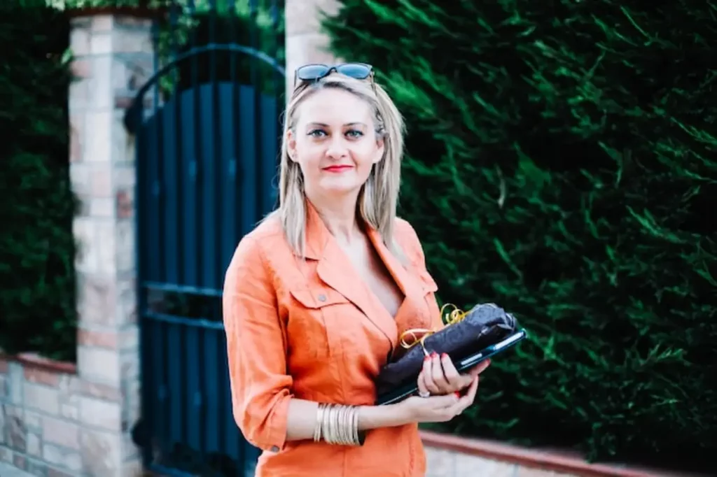 Charming adult woman posing at street